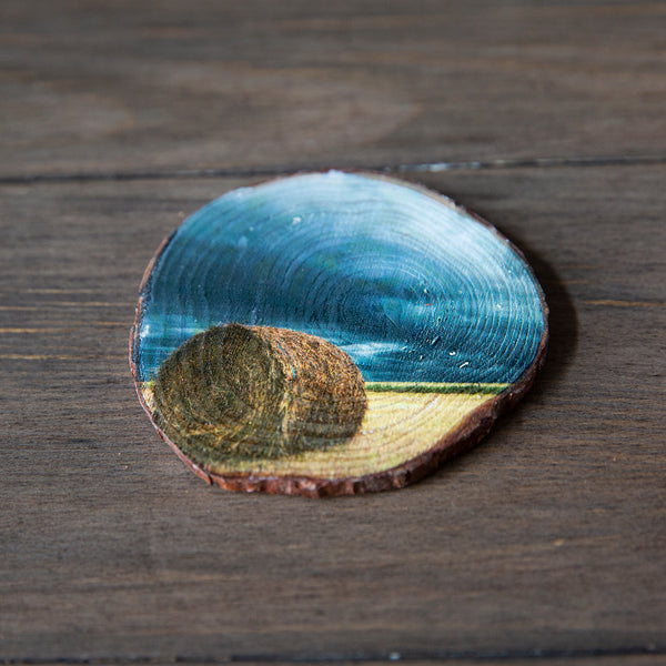 Wood magnet of a hay bale sitting in a field waiting for the storm to roll in. Handmade in Edmonton by Larry Jang, artist & photographer. Rustic Fridge decor. Souvenir of Canadian prairies.