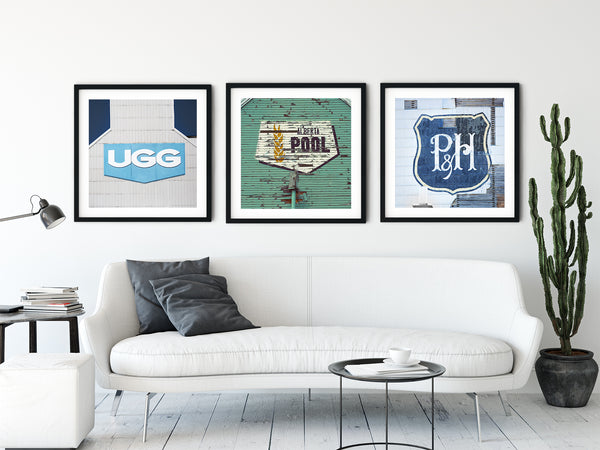 Collection of framed prints in modern living room of iconic Canadian wheat pool operators.