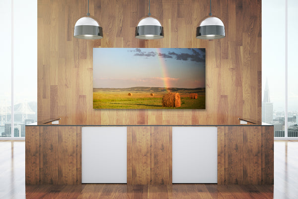 Big canvas print of bales of hay on display in a modern office.