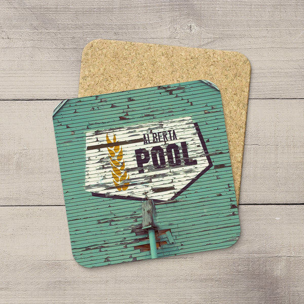 Photo coasters of iconic Alberta Wheat Pool logo taken from the side of a grain elevator by Larry Jang.