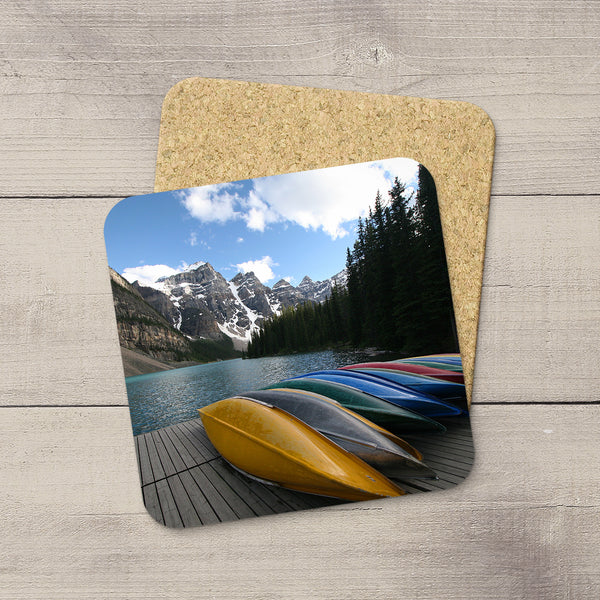 Photo Coasters of Canoes lined up in Moraine Lake, Banff National Park, Canada. Handmade in Edmonton, Alberta by Canadian photographer & artist Larry Jang.