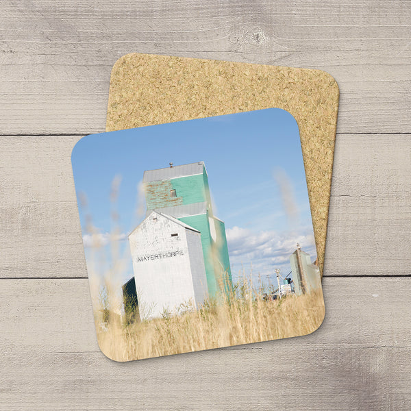Cork Coasters of Mayerthorpe grain elevator as seen through wild prairie grass by Larry Jang.
