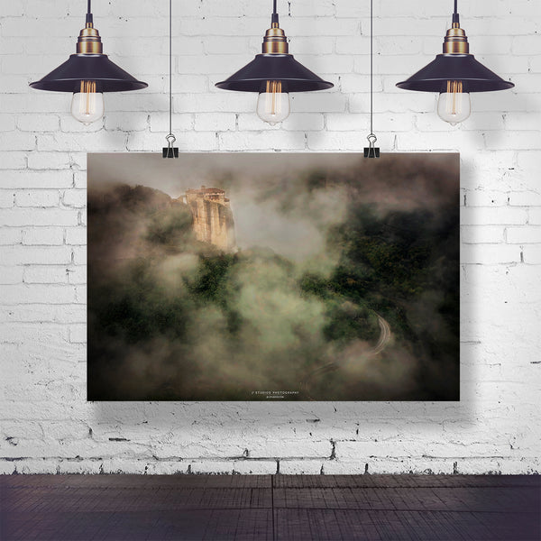 Byzantine monastery on a Greek cliff, surrounded by mist, displayed as a wall print against a white brick background.