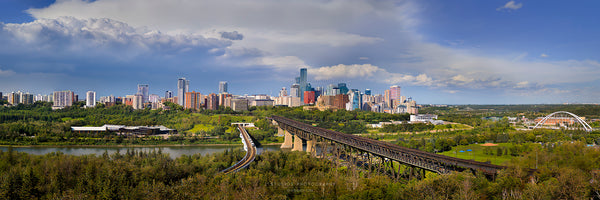 Panoramic cityscape of Edmonton with Legislature Building, High Level, Walterdale, Tawatina and Low Level Bridges. You can also see the LRT and Street Car crossing their resoective brisges. 