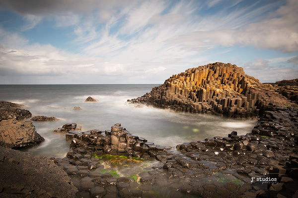 Dramatic Image of waves lapping on the Giant Causeway in Northern Ireland. Landscape Photography.