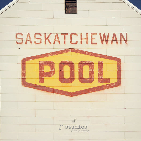 Fine art photography print of the iconic Saskatchewan Wheat Pool logo on a weathered grain elevator. Prairie photography.