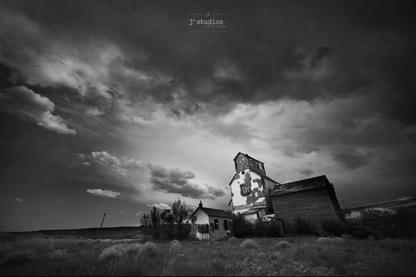 Black and White Art Print of Storm Clouds forming Over Grain Elevator in Alberta Badlands