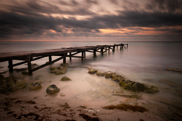 Positive image of a weathered pier bridging the Caribbean Sea at Sunrise. Mexico Photography. IMages of Paya del Carmen.