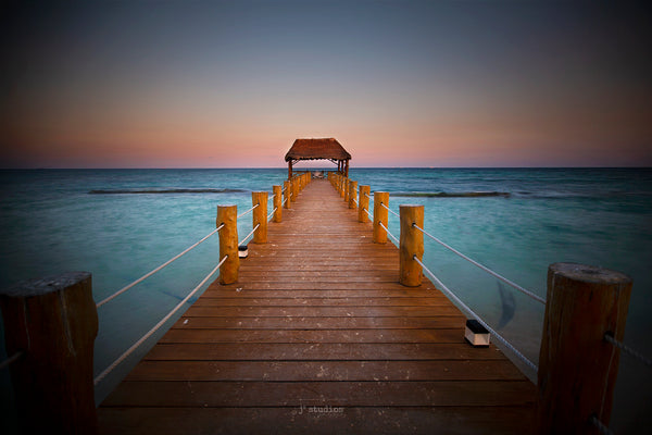 Photograph of a pier leading to a gazebo on the Caribbean Sea at Sunset. Peaceful Fine Art Photography.