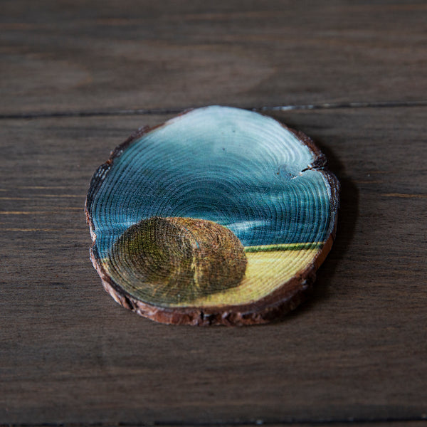 Wood magnet of hay bale sitting under incoming storm clouds. Handmade in Edmonton by Larry Jang, artist & photographer. Rustic Fridge decor. Souvenir of Canadian prairies.