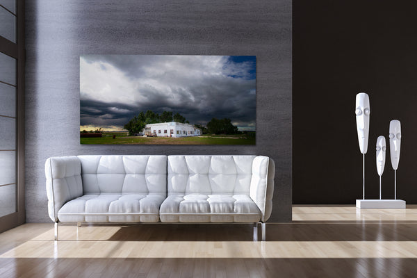 Wall decor ideas. Big canvas print depicting stormy weather on display in modern living room.