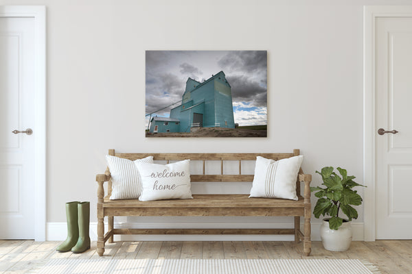 Grain Elevator Canvas of Arrowwood, Alberta hanging on a rustic modern home. Wall decor by Photographer Larry Jang.
