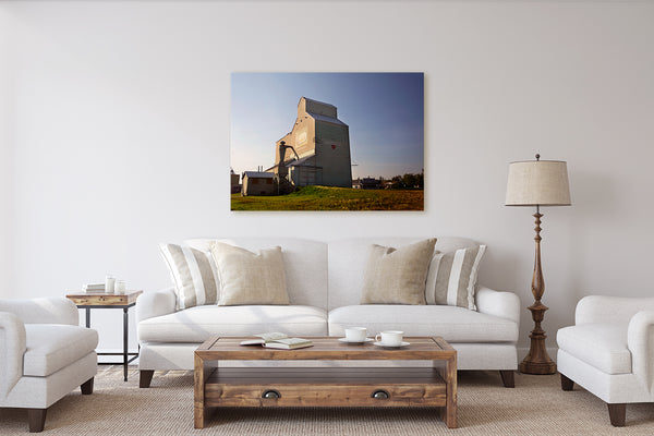 Canvas print of sunset in Barrhead on display in a rustic modern living room. Wall decor  by Larry Jang of J² Studios.