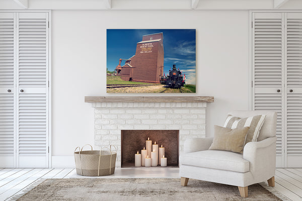 Canvas of a Steam Engine hanging above a fireplace mantle in a modern living room by Larry Jang.