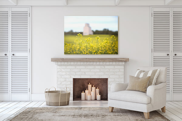 Living room decor with a fireplace ideas big canvas of canola flowers.