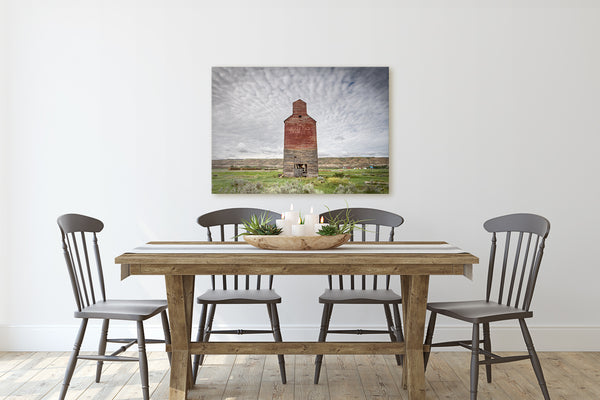Big print of Grain Elevator in Badlands hanging in rustic modern dining room. Farmhouse decor. 