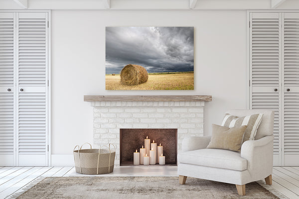 Modern rustic living room with a canvas print of hay bale sitting in a farmer's field. Fireplace decor.