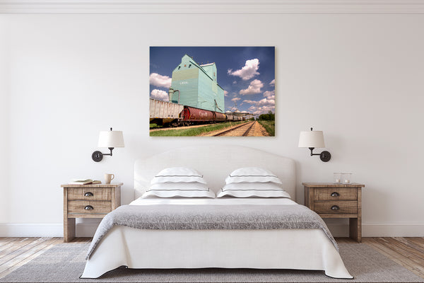 Bedroom decor ideas big canvas print of grain elevator with Canada hopper train cars.