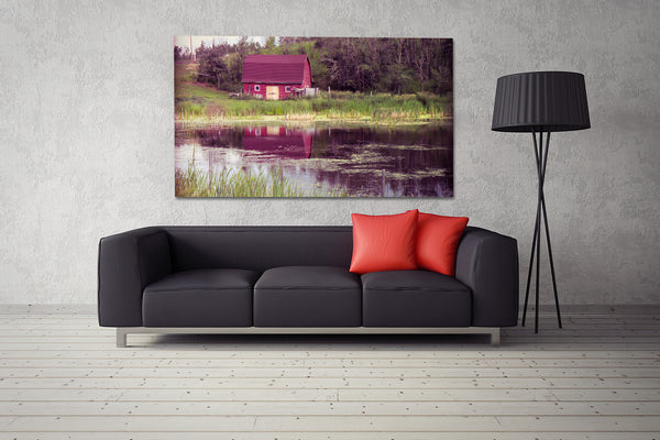 Modern prairie style with canvas of red barn hanging on living room wall.