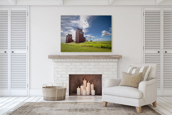 Canvas print of Rowley hanging on the mantle of a fireplace. 