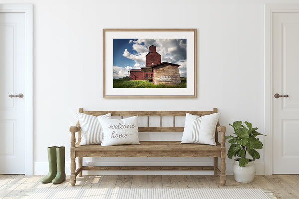Modern art in entry room of a trendy rustic farmhouse.