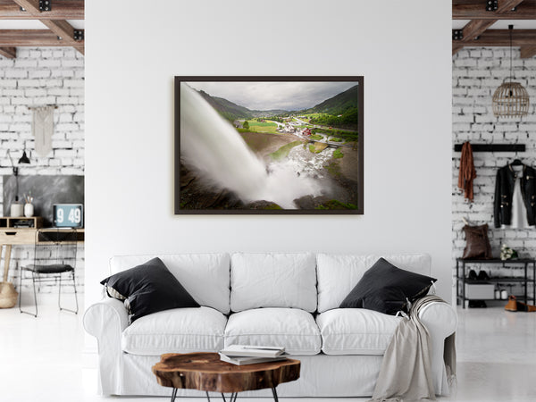 Framed waterfall print hanging on urban walls of a Norweigan apartment.