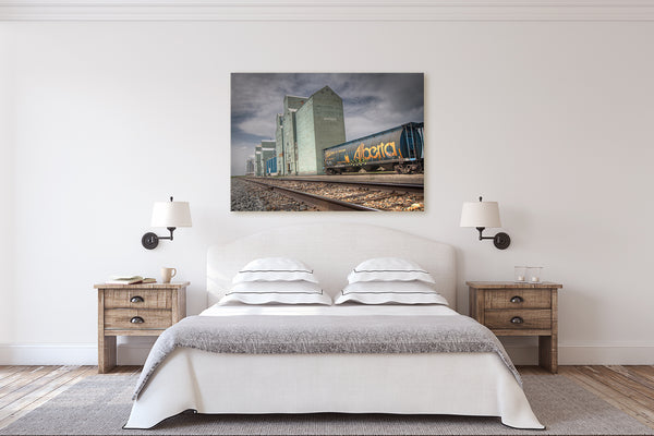 Canvas print expressing Alberta pride on wall of modern bedroom.