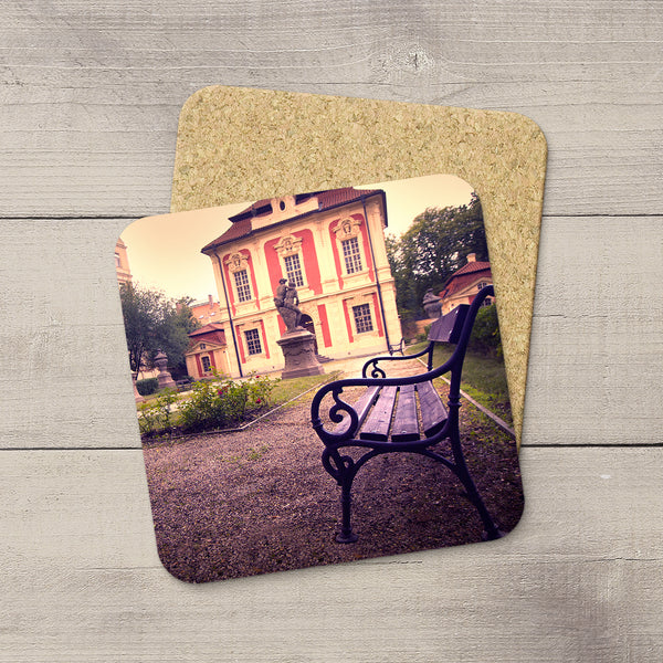 Photo of a park bench in Dvorak's garden in Prague, Czech Republic printed on beverage coasters by Larry Jang.