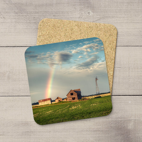 Drink Coasters of an abandoned farm with a rainbow of hope arcing into it. Prairie love themed table art by Larry Jang.