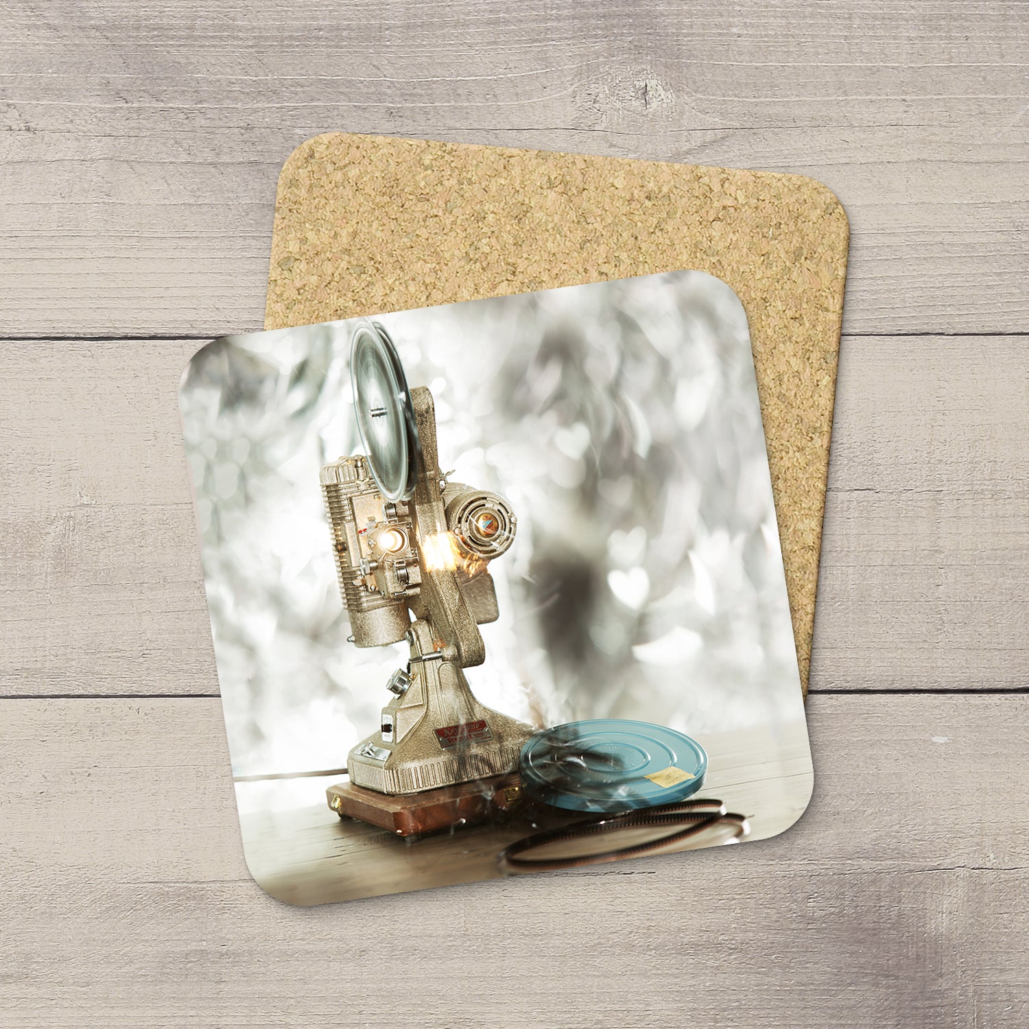 Home Accessories. Photo Coasters of a movie projector playing a movie. Heart bokeh.  Modern functional art by Edmonton artist & photographer Larry Jang.