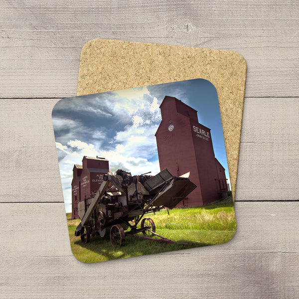 Photo coasters featuring Rowley Grain Elevators and vintage thresher by Larry Jang.