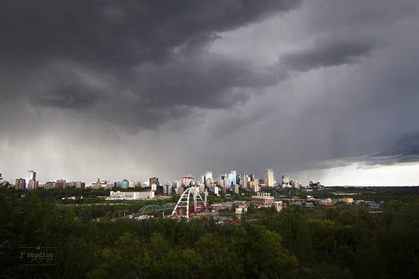 Image of a summer storm over the city of Edmonton featuring the Walterdale bridge. Urban photography.
