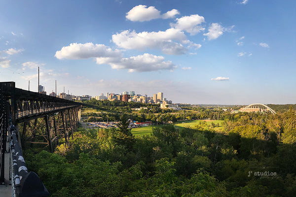 Image of Edmonton's River Valley with the High Level Bridge and City Skyline looming over the North Saskatchewan River by YEG photographer Larry Jang.