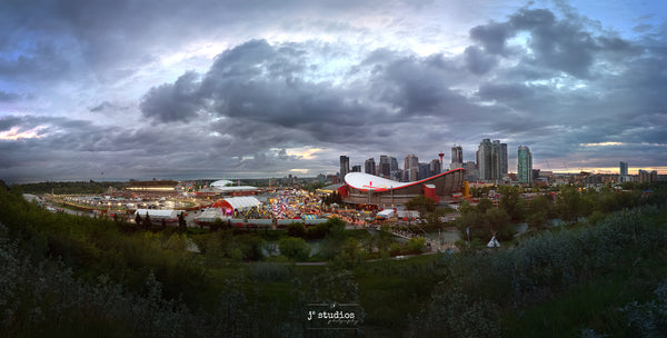 Panorama photograph of Calgary Skyline, Saddledome and world famous Stampede festival.
