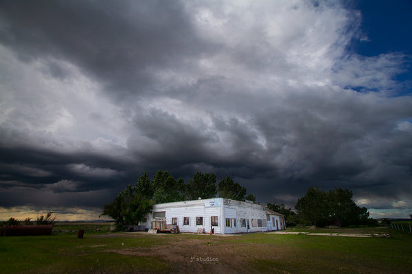 Picture of Incoming storm clouds over an Abandoned Grocery Store in Southern Alberta. Canadian Prairies Photograph depicting life on prairies.