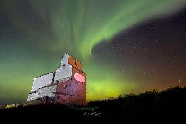 Auroras dancing over Grain Elevator in Legal, Alberta.