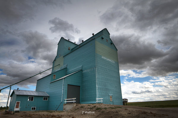 Storm Clouds over Arrowwood Grain Elevator on Alberta Prairies. Photography by Larry Jang of J² Studios Photography & Craft.
