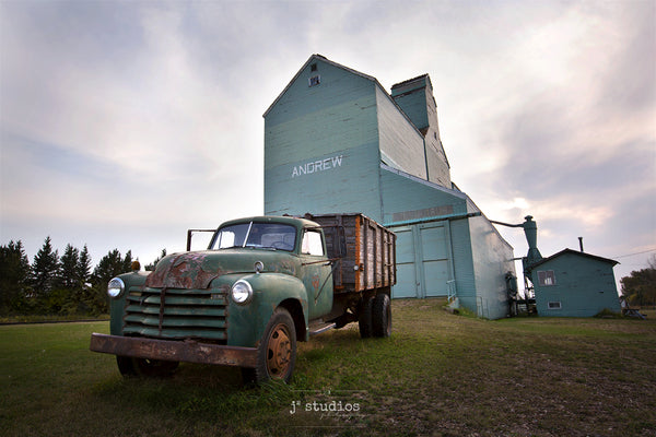 Image of a 1950s Vintage Truck parked in front of the Andrew grain elevator.  Photography of the Canadian Prairies by Larry Jang.