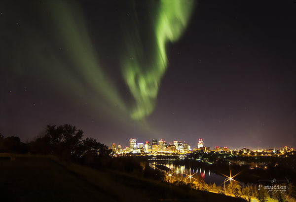 Aurora Over Edmonton #1 is an art print of the northern lights forming over the city of Edmonton.