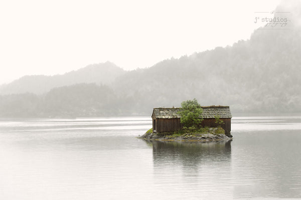 Boathouse in the Mist is an image of a weather worn boat shelter on a fjord in Norway.