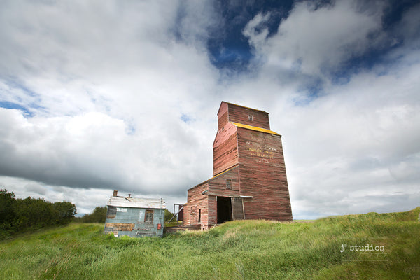 Picture of the Red Alberta Wheat Pool elevator in Butze, Alberta.