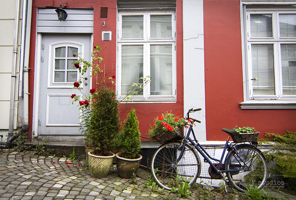 Charming in Bergen, bike print on the cobblestone streets in Norway.