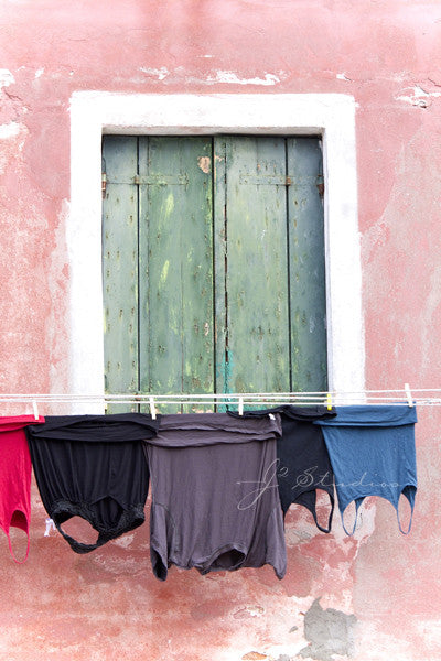 Clothes Line is an art print of drying laundry in Burano, Italy.