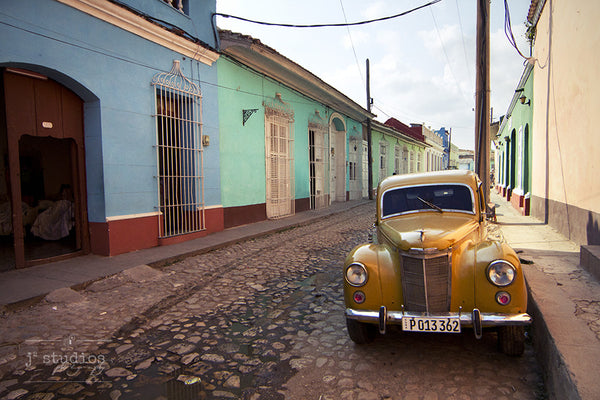 Cuba Classic #1 is an image of a old yellow car on the streets of Trinidad. Beautiful old car photography.