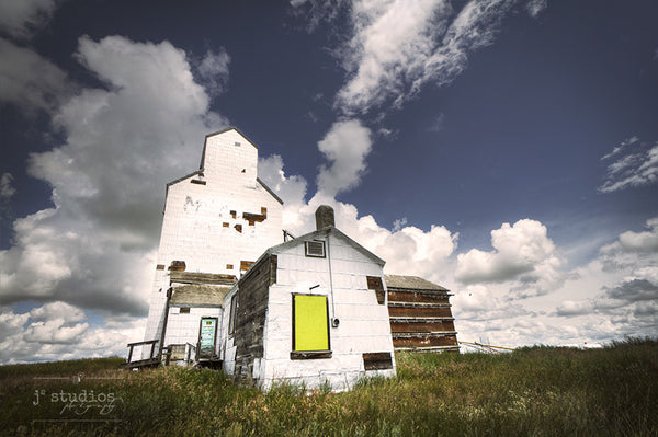 Art Print of the weathered white Ogilvie grain elevator in Wrentham, Alberta. Canadian prairies photography by Larry Jang.
