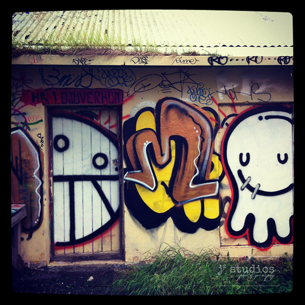 Graffiti Faces is an art print of a street art painted wall. 