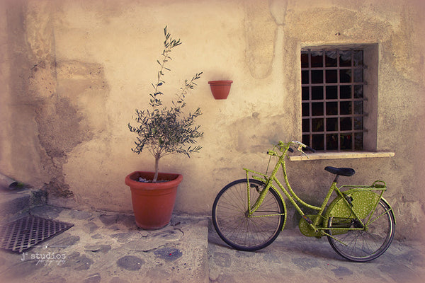 Green Bicycle is an image of a lime green bicycle parked in a charming alleyway in the Cinque Terre of Italy. Travel Photography.