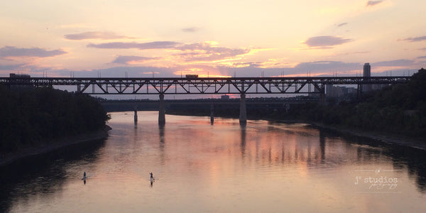 High Level Crossing is an image of sunset over the bridge and the North Saskatchewan River. 