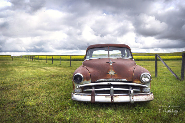 Art print of a weathered 1950s Dodge Plymouth sitting in a farmers field in Alberta. Canadian Prairies photography.