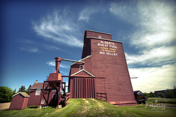 Jewel of Big Valley is an image of a red Alberta Wheat Pool grain elevator. Heritage inspired landscape photography.
